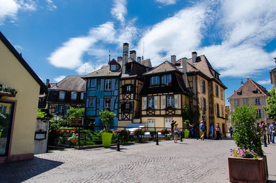 Buildings in town against sky