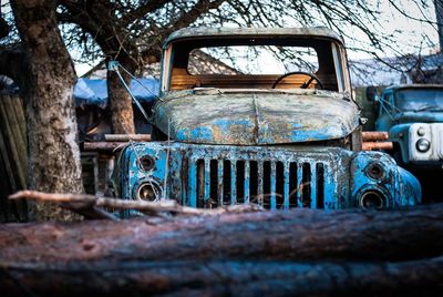 Old rusty car on road