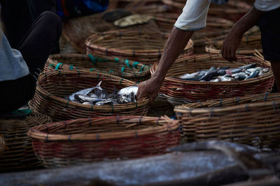 Midsection of man working in basket