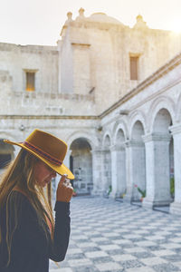 Tourist woman walking on vacation in street, arequipa, peru. selective focus