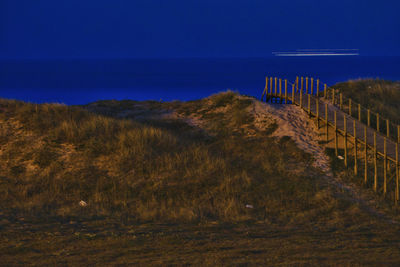 Scenic view of sea against sky at night