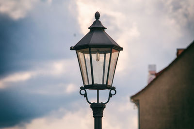 Low angle view of street light against sky