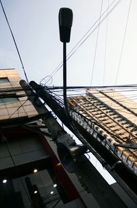 Low angle view of cables against sky