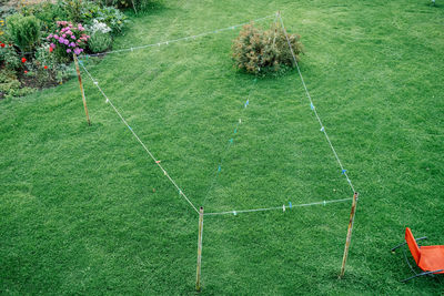 High angle view of clothesline over field