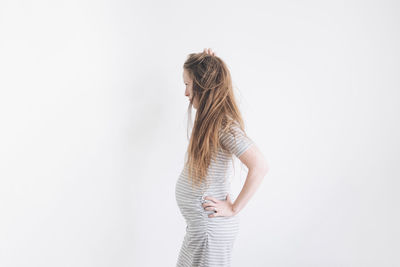 Pregnant woman in a grey dress 