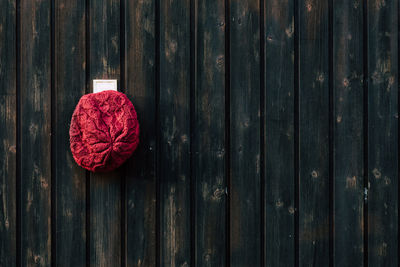 Directly above shot of knit hat on wooden door
