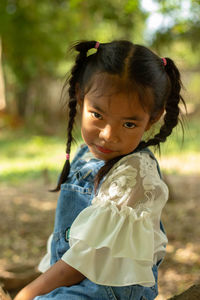 Portrait of cute girl on field