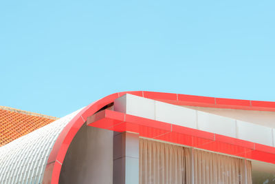 Low angle view of building against clear blue sky