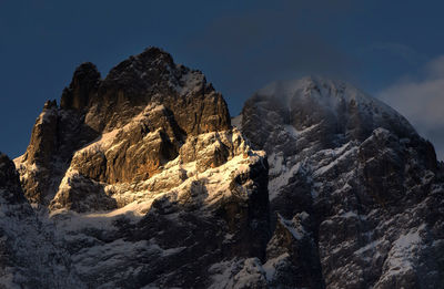 Low angle view of rock formations against sky