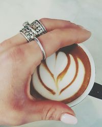 Close-up of woman holding coffee cup