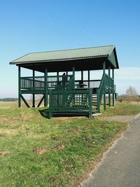 Built structure on field against clear sky