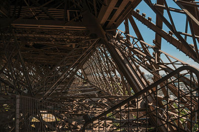 Low angle view of metallic structure against sky