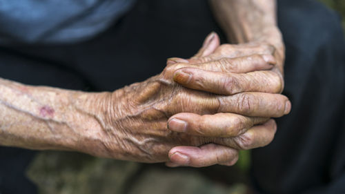 Close-up of human hand holding outdoors
