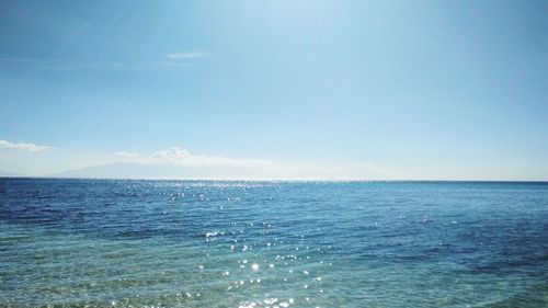 Scenic view of sea against blue sky