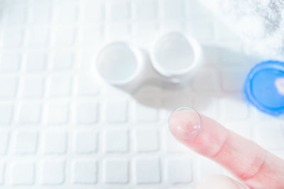 High angle view of person holding camera