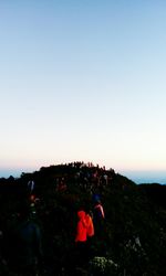 People against clear sky during sunset