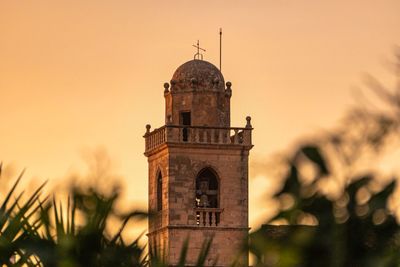 View of old building against sky during sunset