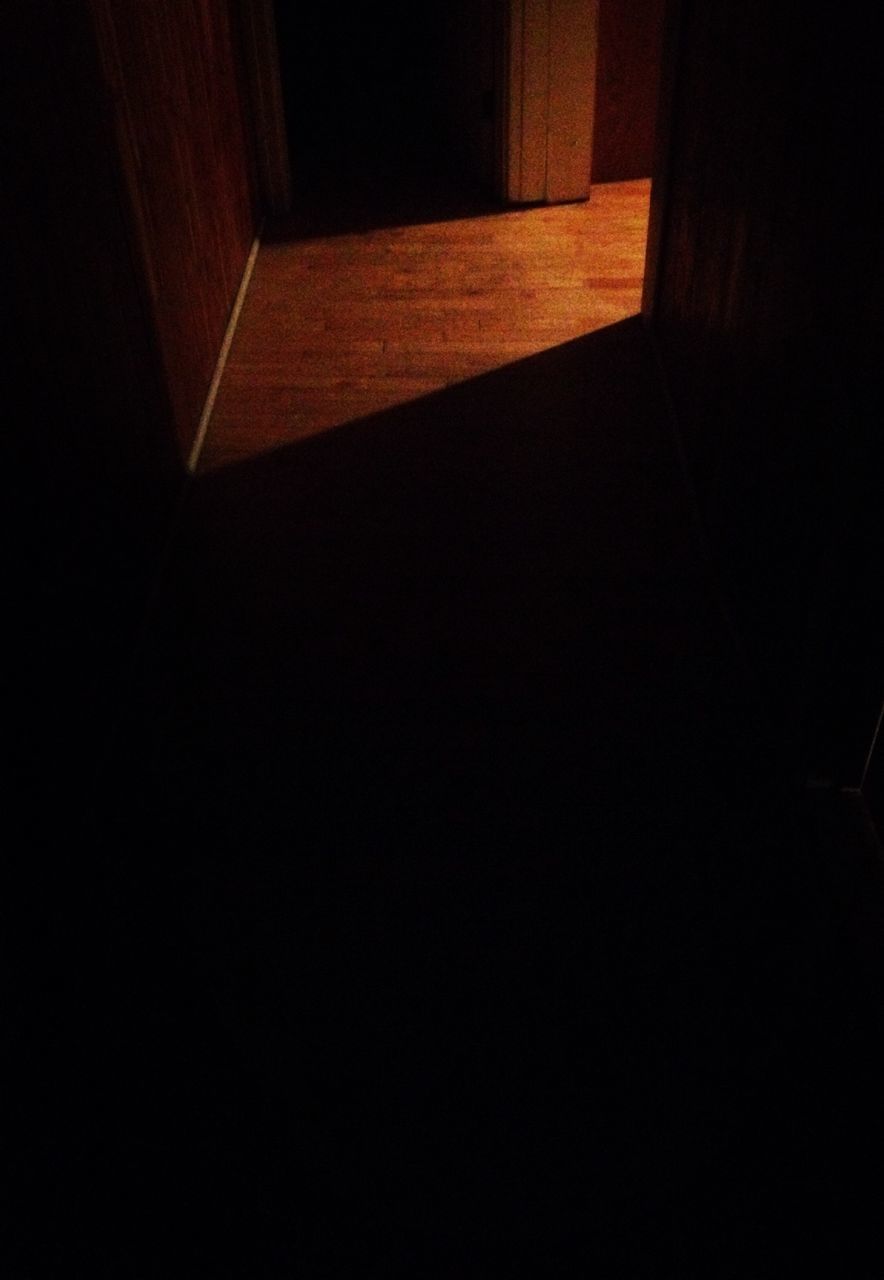 indoors, built structure, architecture, dark, wall - building feature, shadow, house, night, no people, sunlight, wall, illuminated, building, copy space, door, home interior, empty, steps, building exterior, high angle view