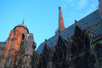 Low angle view of church against blue sky