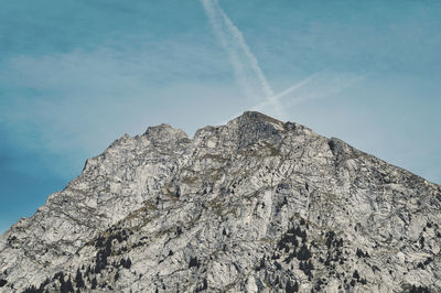 Low angle view of rock formation against sky