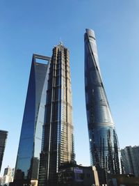 Low angle view of modern buildings against clear sky