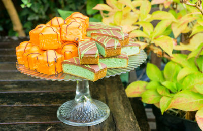 Close-up of dessert on cakestand at table