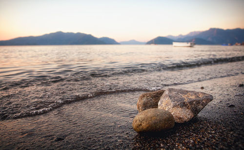 View of calm beach at sunset