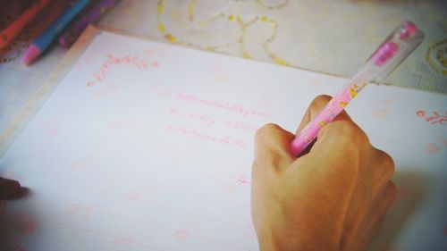 Close-up of hand holding book