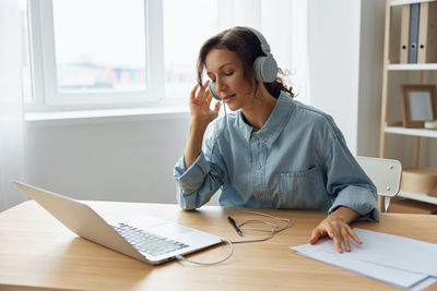 Businesswoman working on table