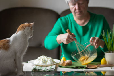 Midsection of man preparing food at home