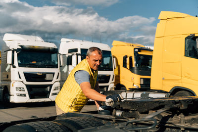 Rear view of man working on field