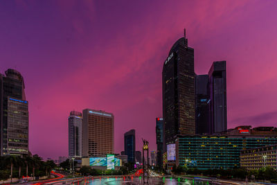 Illuminated buildings in city at night