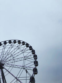 Low angle view of ferris wheel against clear sky