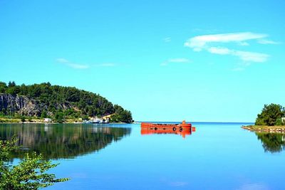 Reflection of clouds in calm sea