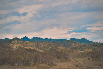 Scenic view of landscape against sky during sunset