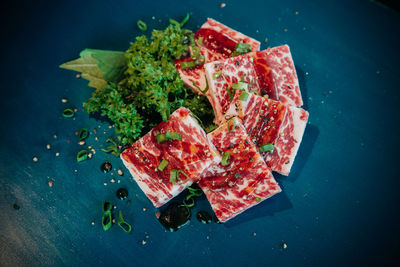 High angle view of meat and salad in plate