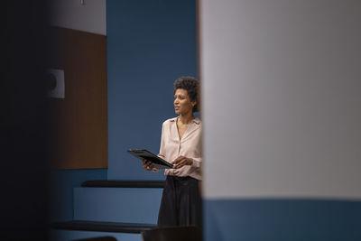 Businesswoman practicing speech in office board room
