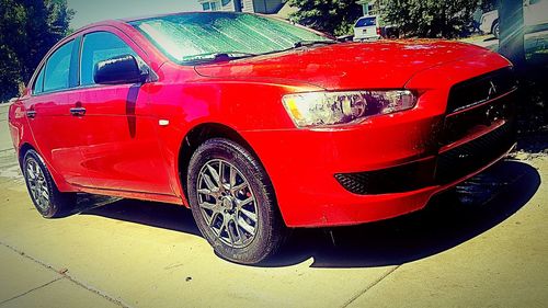 High angle view of red car on street