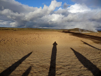 Shadow of person on sand