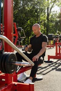 Portrait of man exercising in gym