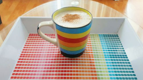 High angle view of coffee cup on table