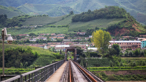 High angle view of railroad tracks amidst mountains