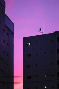 Low angle view of building against sky during sunset
