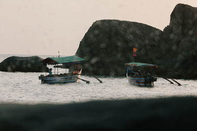 Nautical vessel on sea against clear sky