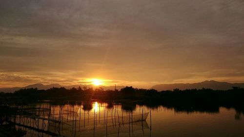 Scenic view of lake at sunset