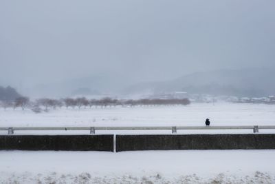 Scenic view of frozen lake against clear sky