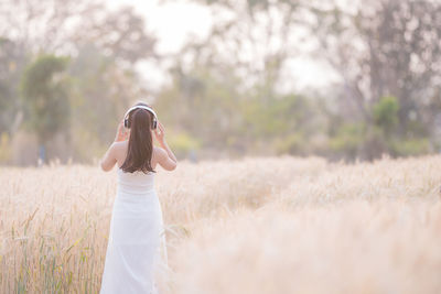 Woman standing on field