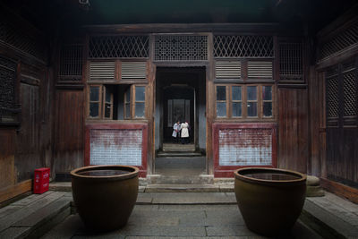 Empty room with open door of building