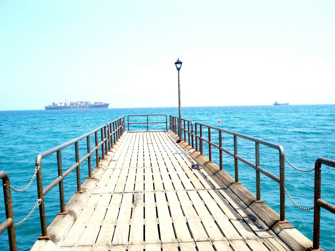 sea, water, horizon over water, clear sky, the way forward, blue, pier, railing, tranquil scene, tranquility, scenics, copy space, beauty in nature, nature, diminishing perspective, built structure, long, idyllic, jetty, vanishing point