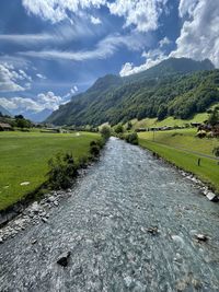 Scenic view of landscape against sky with cereal clear glacier river 